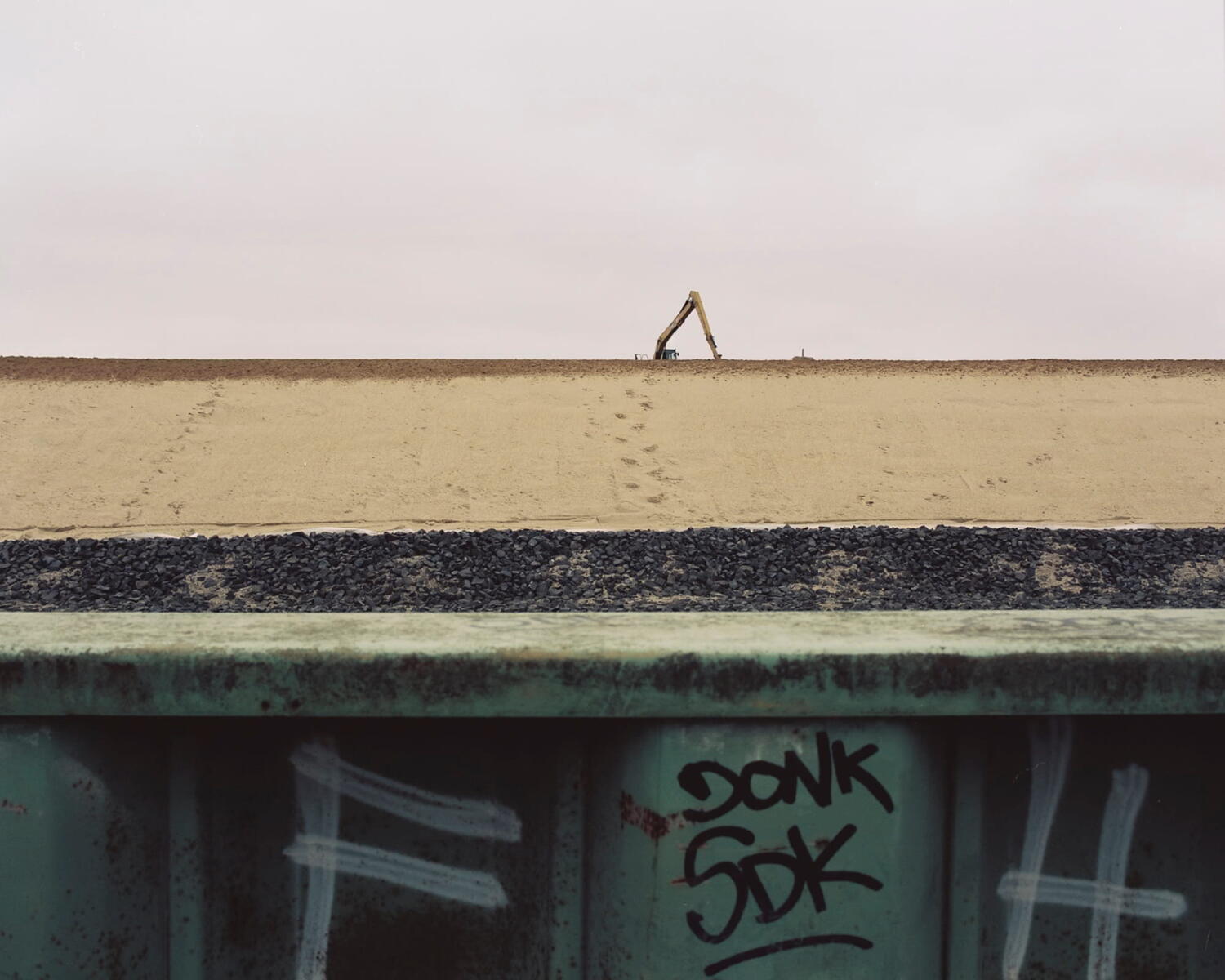 Crane on the horizon at a building site.