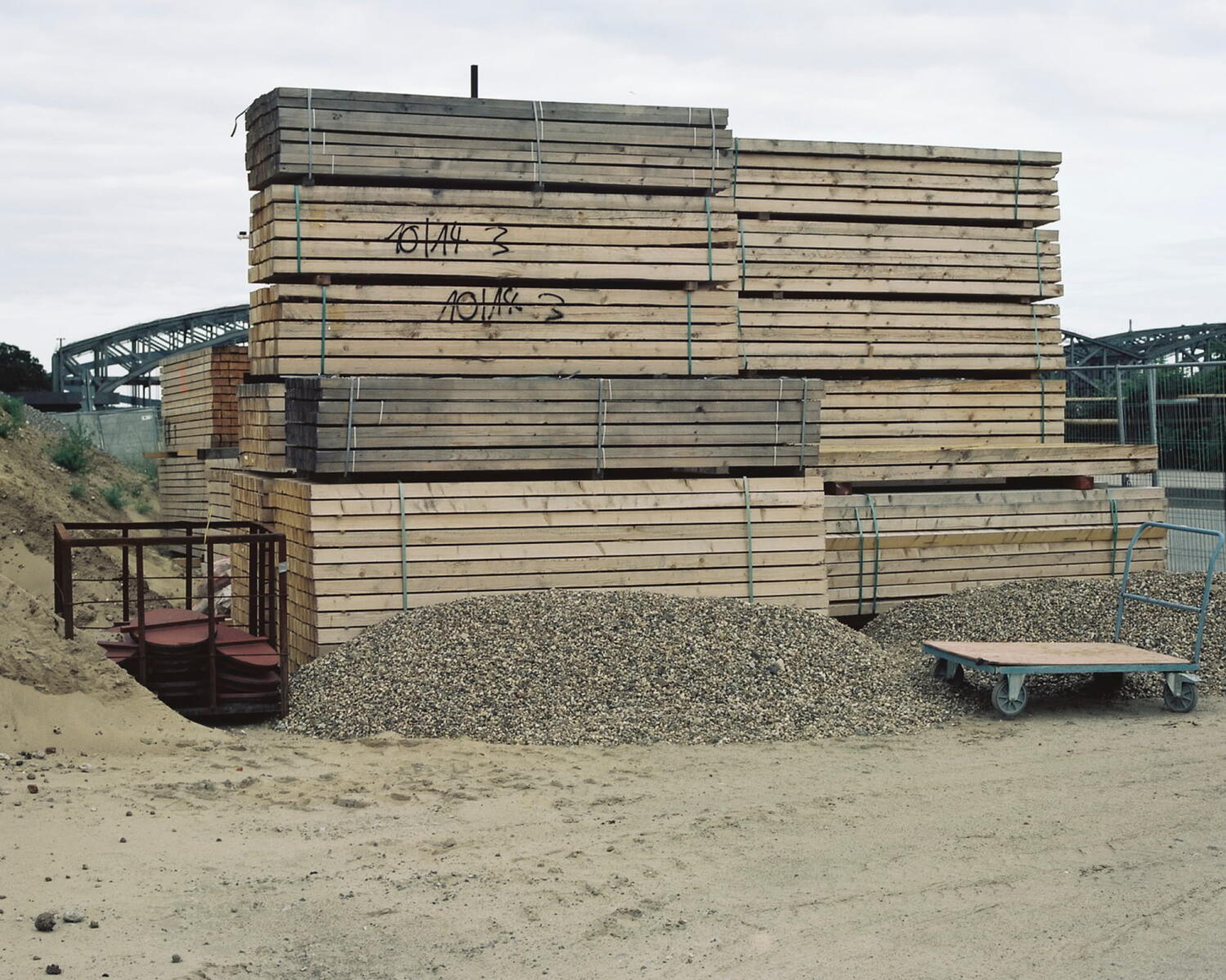 Stack of wooden boards on a building site.