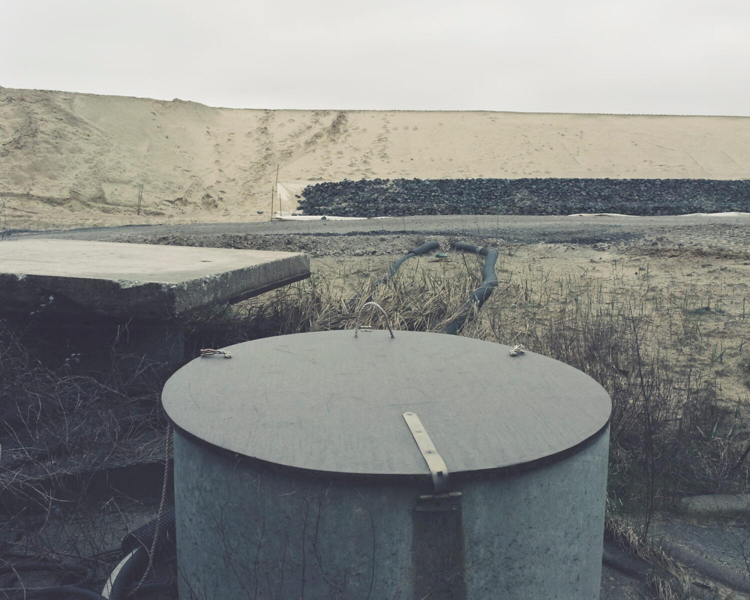 Round tank on a building site.