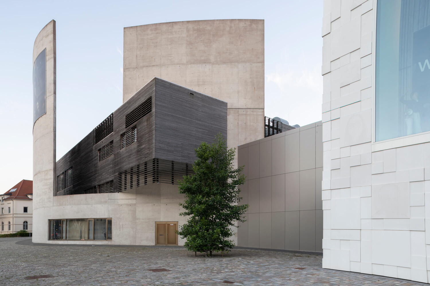 Side view of the wood and concrete structure of the German Emigration Center by Andreas Heller Architects in Bremerhaven. 