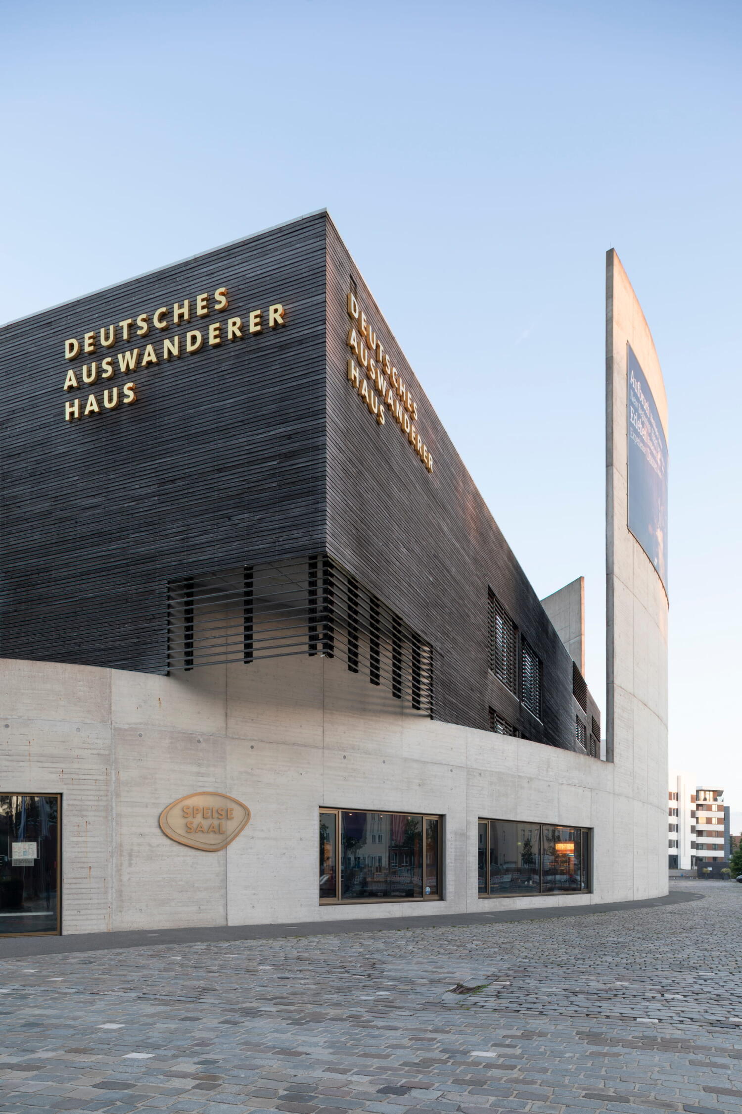 Side view of the wood and concrete structure of the German Emigration Center by Andreas Heller Architects in Bremerhaven. 