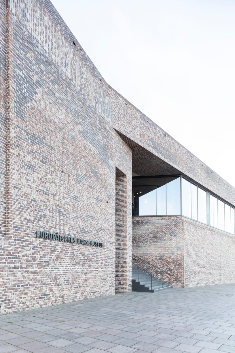 Side view of the red brick façade of the European Hanseatic Museum by Andreas Heller Architects in Lubeck.