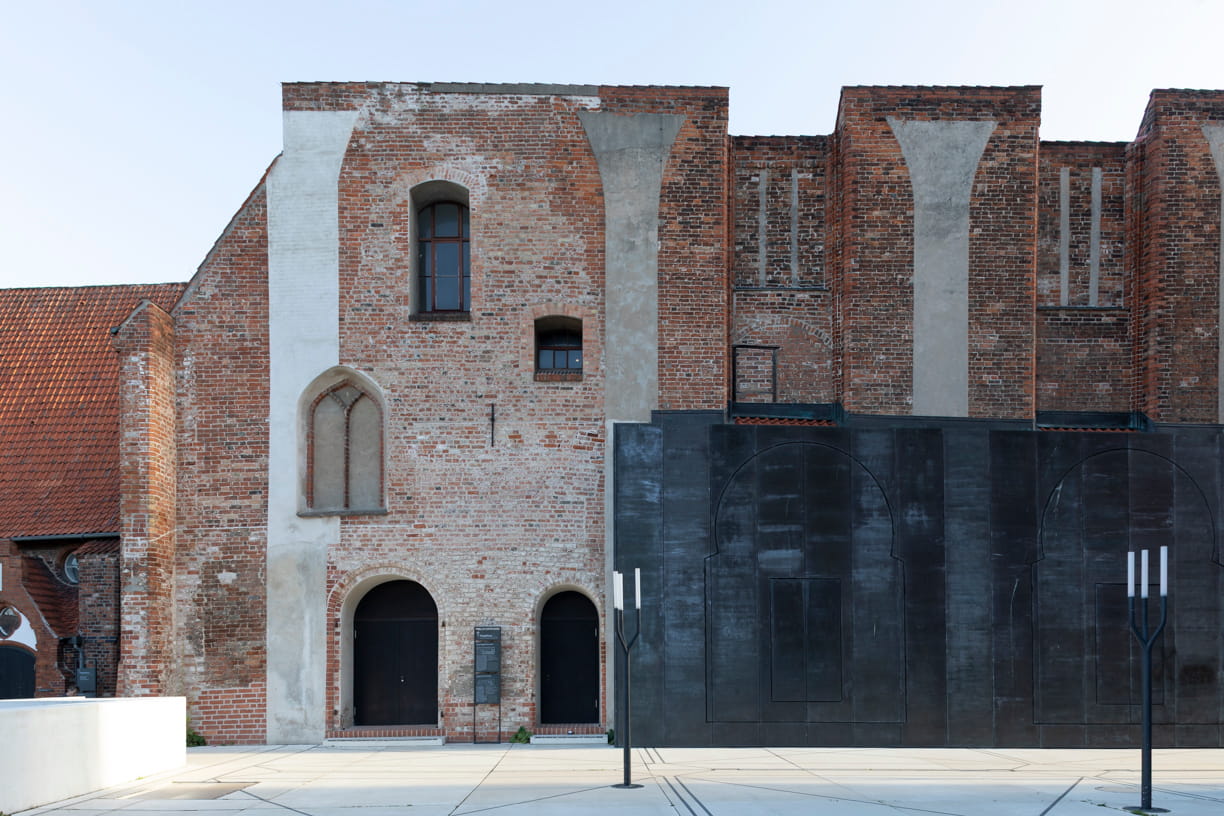 Red brick and iron façade of the European Hansemuseum by Andreas Heller Architects in Lübeck.