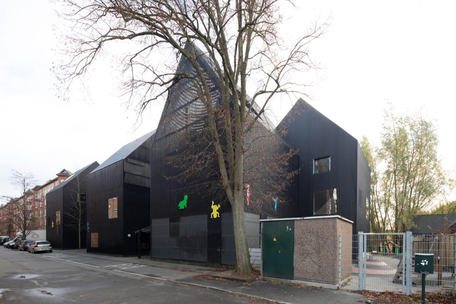 Based on the concept of a playhouse for children, Frederiksvej Kindergarten extends in black and white volumes. Frederiksvej Kindergarten by Cobe Architects in Copenhagen.