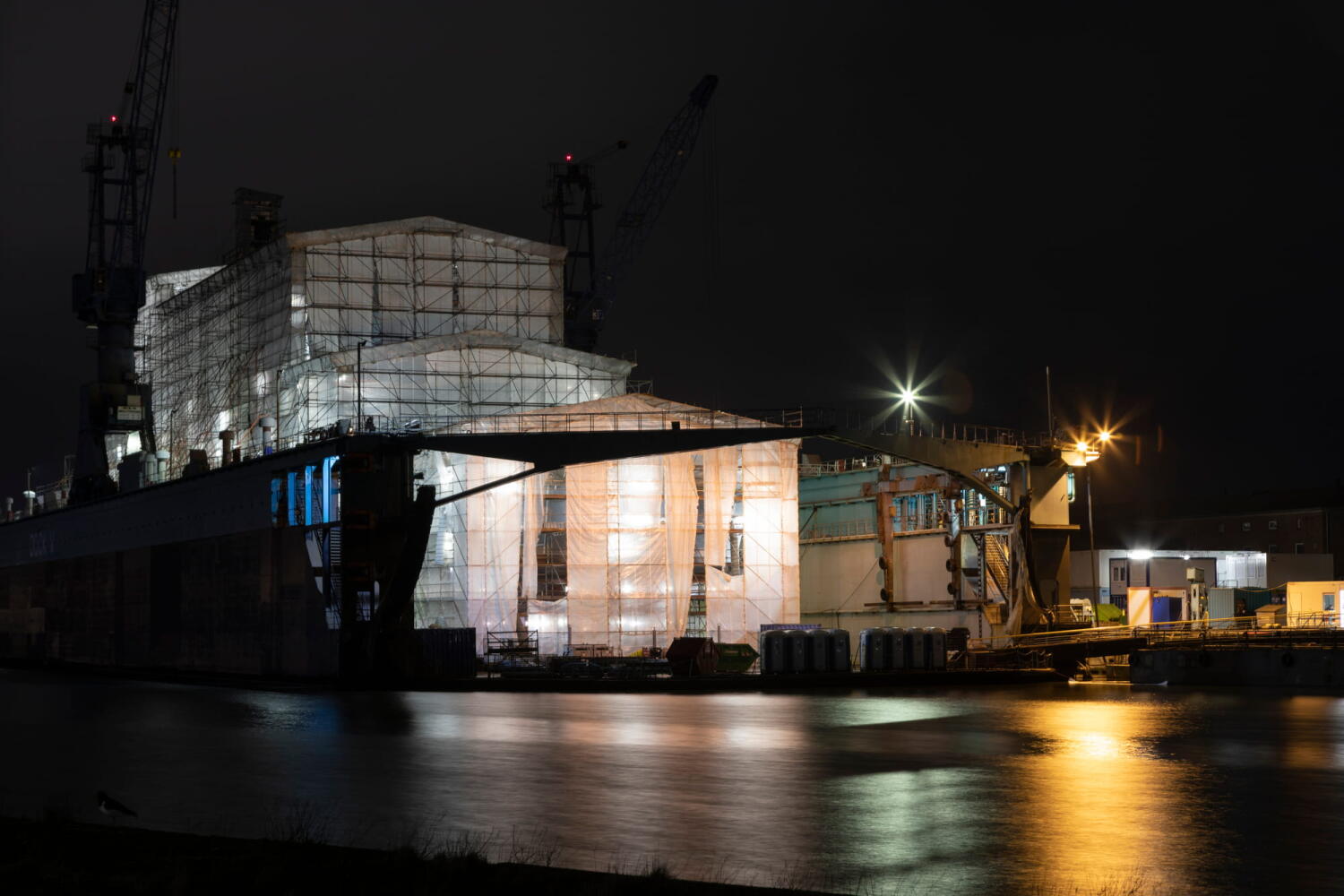 Shipyard from the “Night Beasts” series. During the night, these industrial facilities transform into fantastic creatures that form a bestiary.