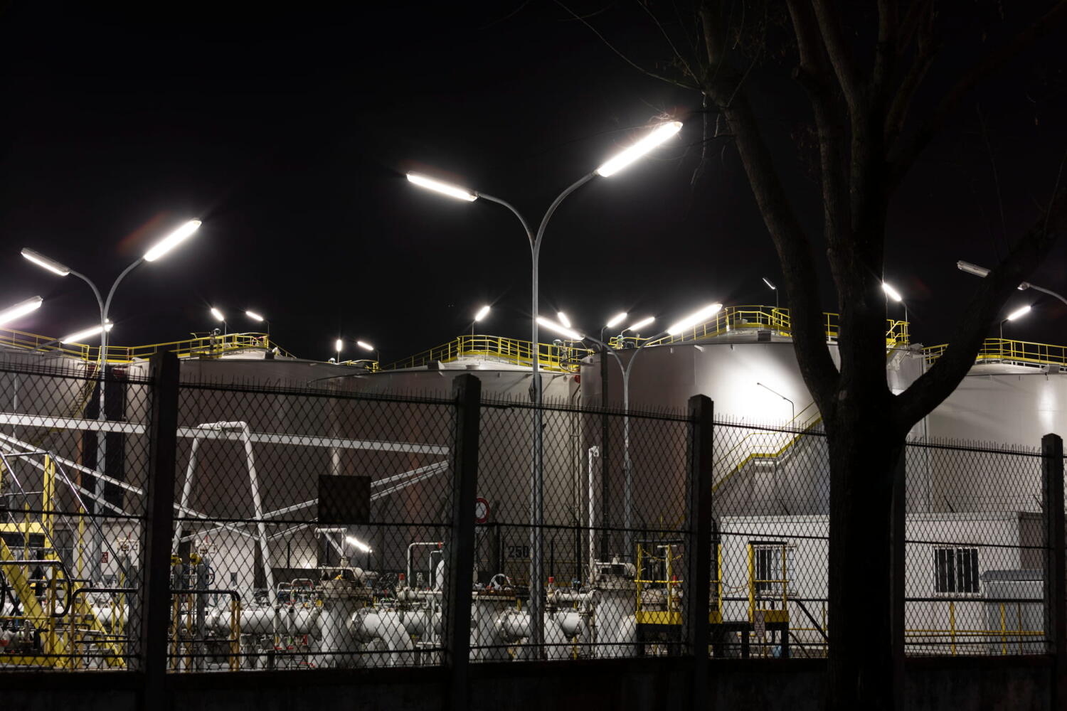Silos and lights from the series “Night Beasts.” During the night, these industrial facilities transform into fantastic creatures that form a bestiary.