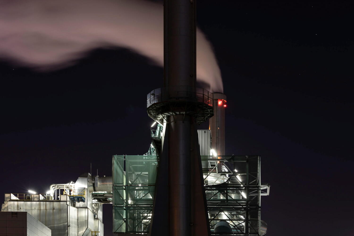 Chimney and its smoke from the series “Night Beasts.” During the night, these industrial installations transform into fantastic creatures that form a bestiary.