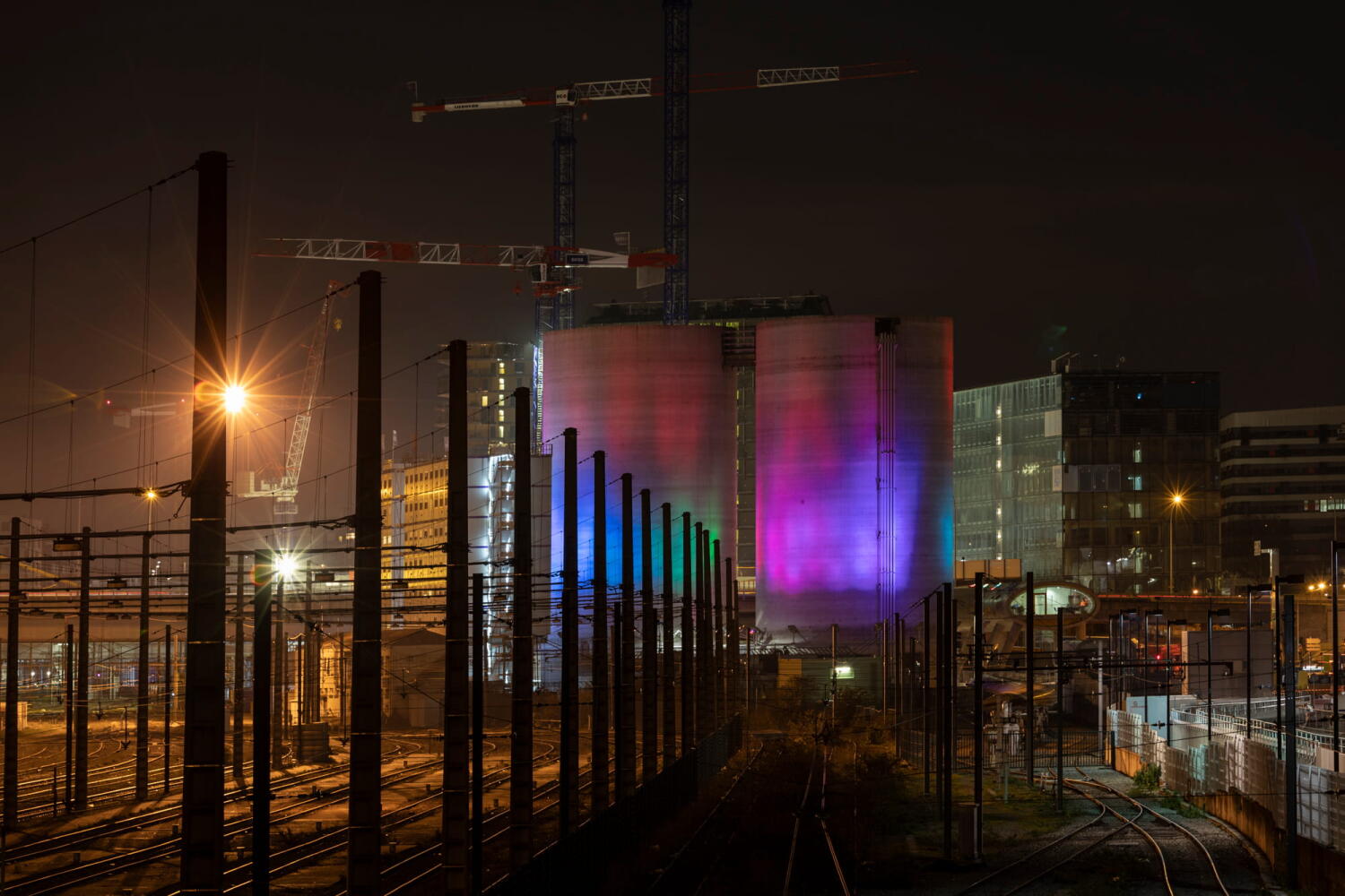 Coloured silos from the “Night Beasts” series. At night, these industrial plants transform into fantastic creatures that form a bestiary.