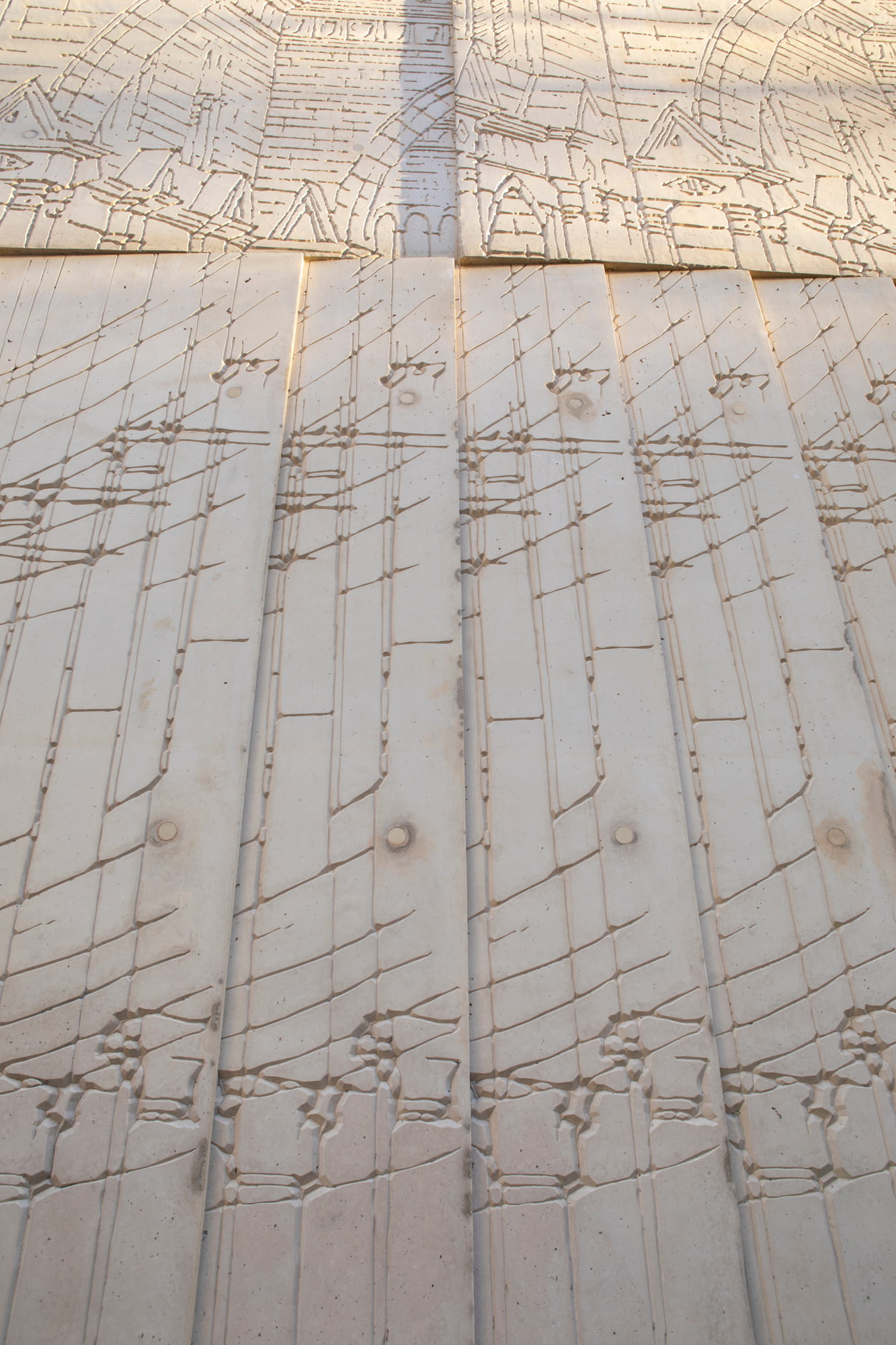 The façade is decorated with greatly enlarged fragments of architectural sketches in relief form. Tchoban Foundation Museum for Architectural Drawing by Tchoban Voss Architects in Berlin.