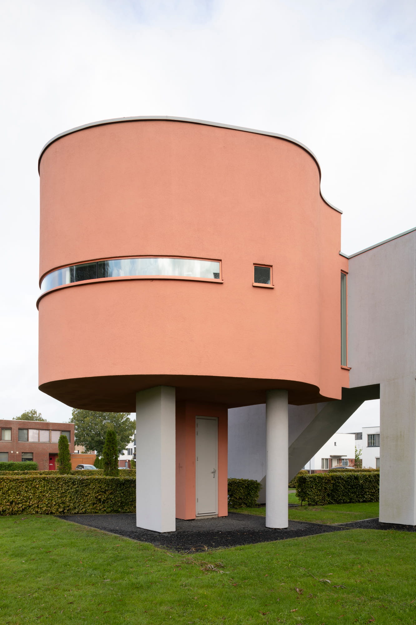 Lateral view of the playful volume made of colored reinforced concrete at Wall House #2 by John Hejduk Architect in Groningen, Holland. 
