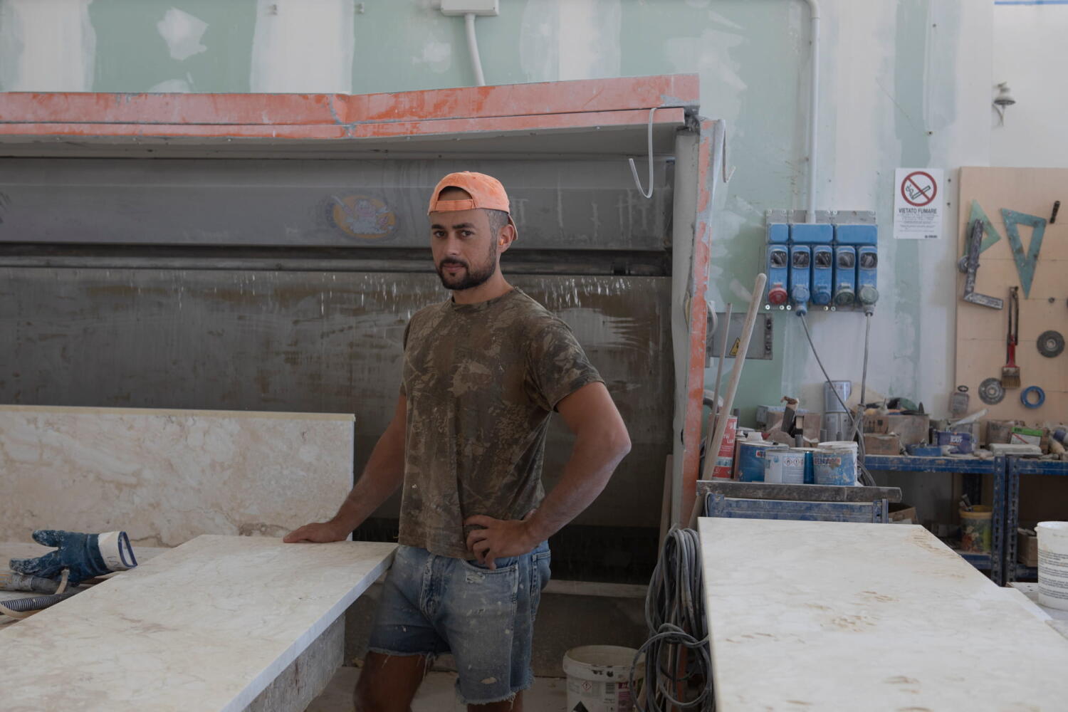 Workers cutting travertine slabs.